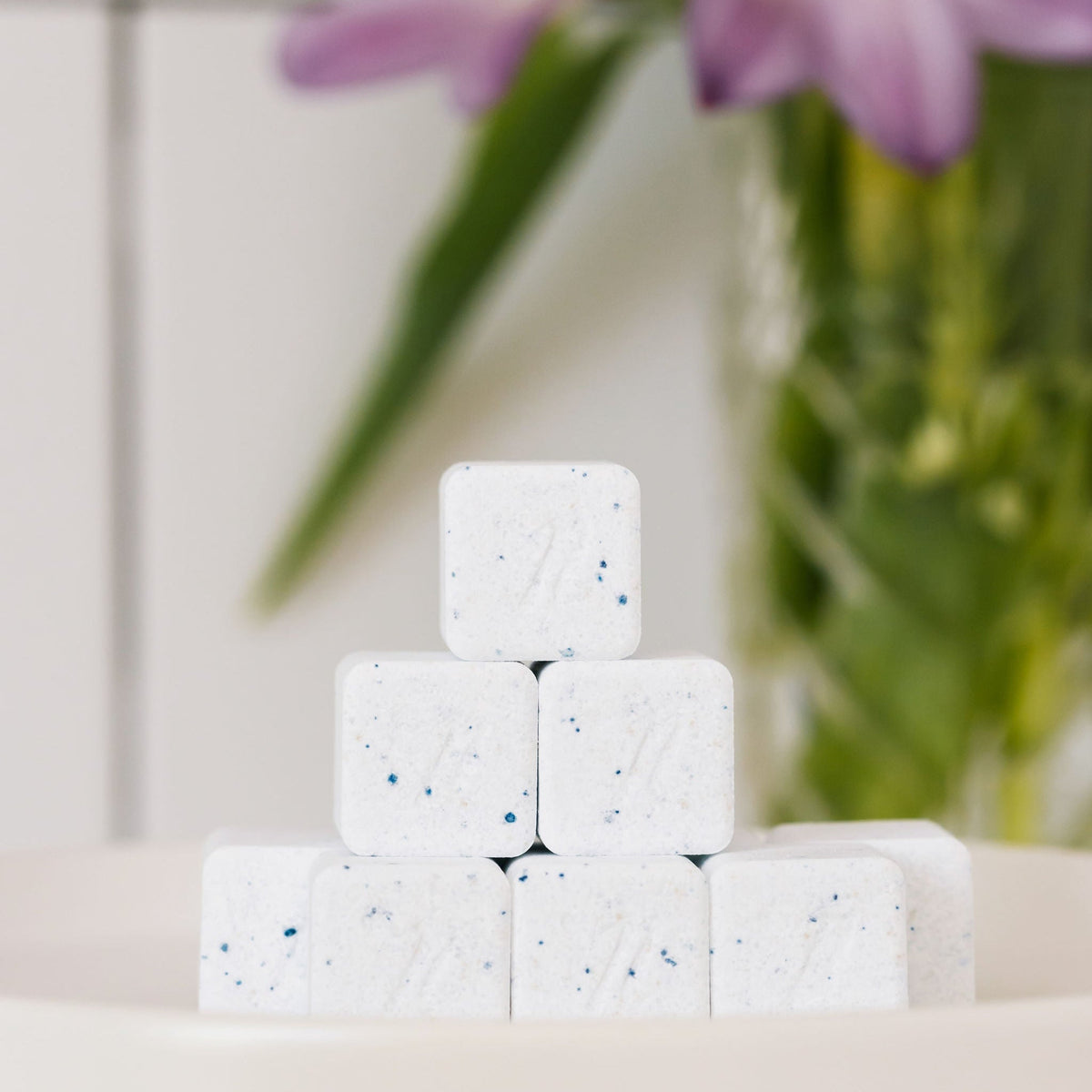 Nellie's dishwasher detergent cubes shown close up; 720-count bulk packaging not pictured
